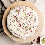 Persian Love Cake is a rich, moist, and nutty almond cake loaded with floral and citrus flavors, topped with a lemon glaze, pistachios, and rose petals. | aheadofthyme.com