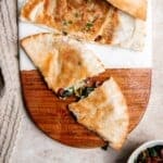 Quick easy pita grilled cheese is loaded with Mediterranean flavors of spinach, olive, and sun-dried tomato stuffed inside pita bread with cheddar cheese. | aheadofthyme.com