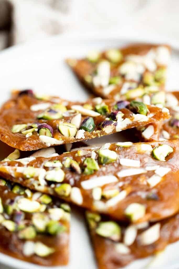 Sohan (Persian Pistacho Brittle) is a traditional Persian candy that is sweet, floral, and nutty, has the best crunchy texture, and is loaded with nuts. | aheadofthyme.com