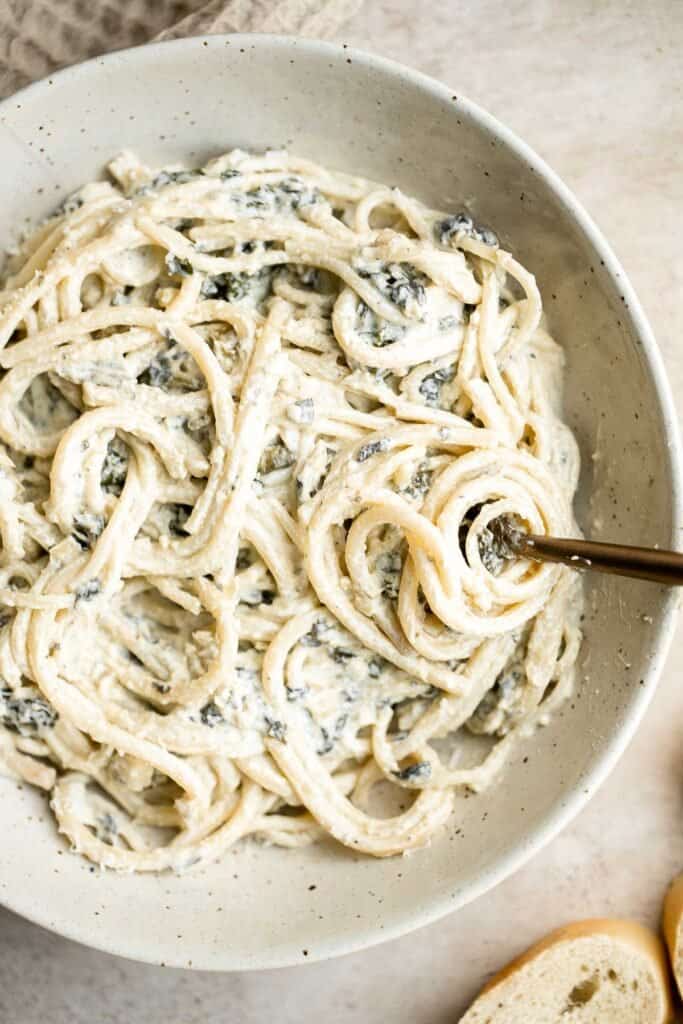 If you’re a fan of spinach artichoke dip, you need to try this spinach artichoke pasta. It's quick and easy comfort food is ready in under 30 minutes. | aheadofthyme.com