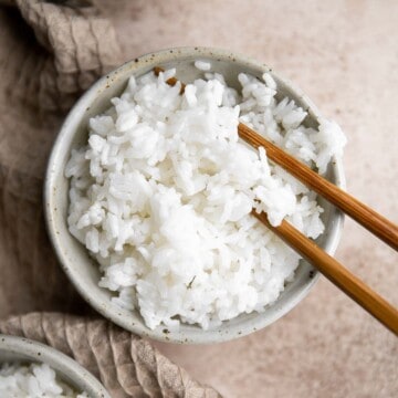 Learn how to make steamed rice that's perfectly cooked, fluffy and delicious in 30 minutes. Cook white rice on the stove, rice cooker, or instant pot. | aheadofthyme.com