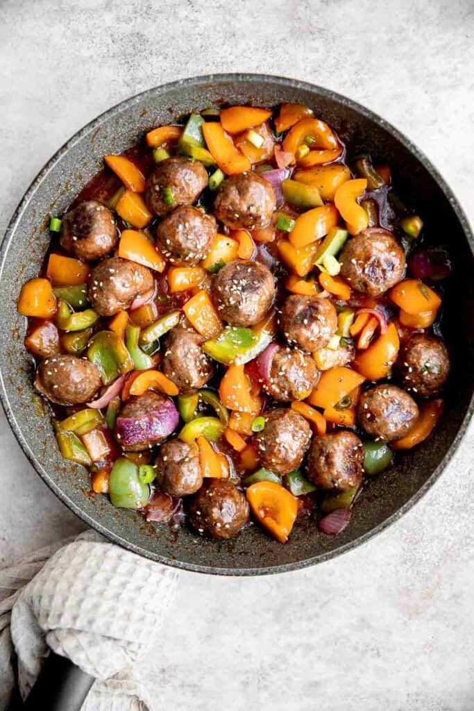 Sweet and sour meatballs are quick, easy, delicious, and flavorful, tossed in a vegetable and pineapple stir fry with homemade sweet and sour sauce. | aheadofthyme.com