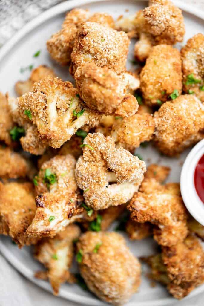 Air fryer cauliflower bites have a crispy breaded coating outside, yet tender and light inside. They are bite-sized, flavorful, easy to make, and healthy. | aheadofthyme.com