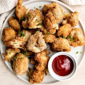 Air fryer cauliflower bites have a crispy breaded coating outside, yet tender and light inside. They are bite-sized, flavorful, easy to make, and healthy. | aheadofthyme.com