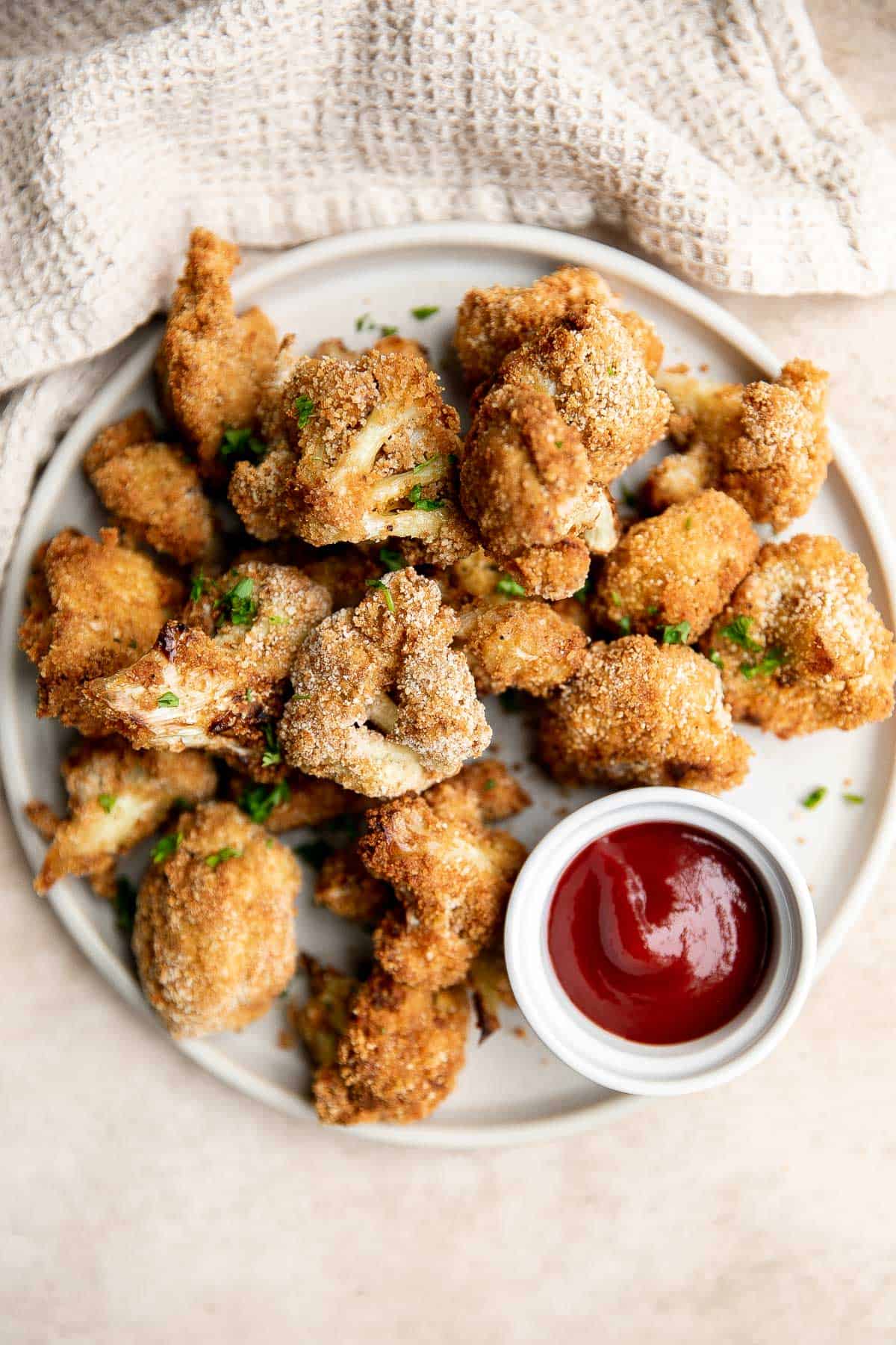 Air fryer cauliflower bites have a crispy breaded coating outside, yet tender and light inside. They are bite-sized, flavorful, easy to make, and healthy. | aheadofthyme.com