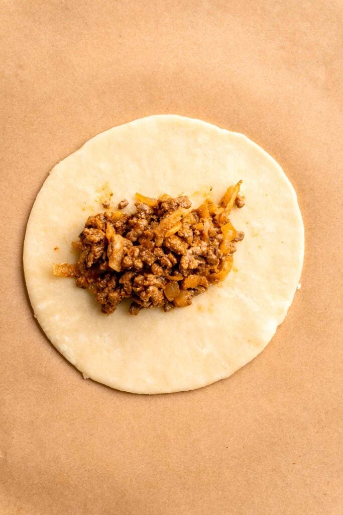 Homemade Beef Empanadas are a celebration of bold Latin-inspired flavors, featuring a savory, spiced ground beef filling wrapped in buttery, flaky pastry. | aheadofthyme.com