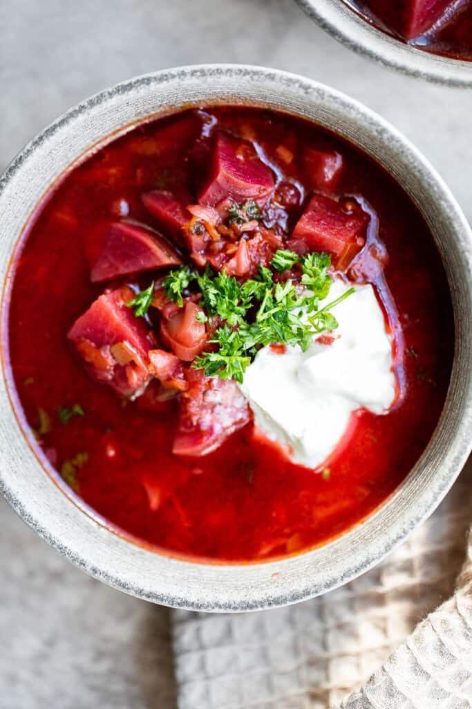 Ukrainian borscht soup is a vegan beet soup made with red beets and vegetables. It's nutritious, flavorful, delicious, easy to make, and freezer-friendly. | aheadofthyme.com