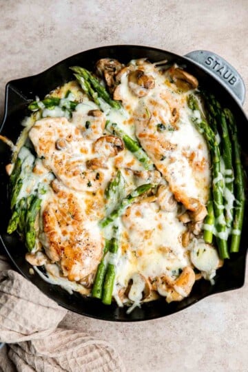 Chicken Madeira Cheesecake Factory copycat with mushrooms, crisp tender asparagus, and creamy Madeira sauce. Easy restaurant quality dinner at home. | aheadofthyme.com