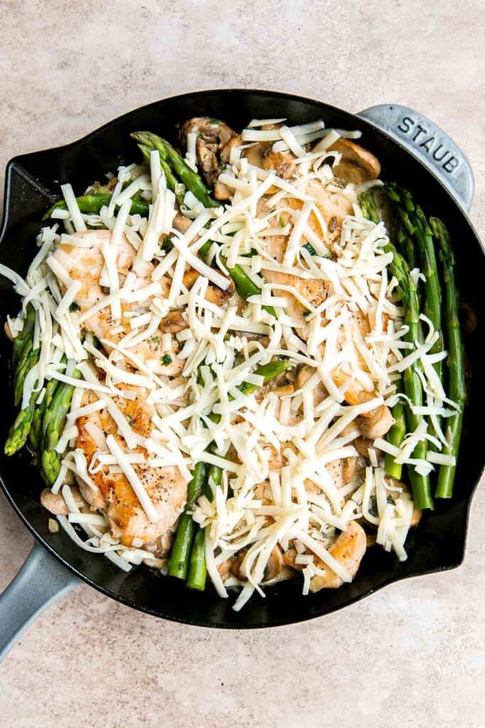 Chicken Madeira Cheesecake Factory copycat with mushrooms, crisp tender asparagus, and creamy Madeira sauce. Easy restaurant quality dinner at home. | aheadofthyme.com