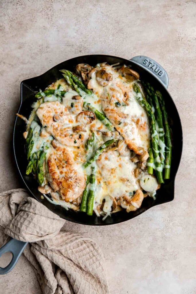 Chicken Madeira Cheesecake Factory copycat with mushrooms, crisp tender asparagus, and creamy Madeira sauce. Easy restaurant quality dinner at home. | aheadofthyme.com
