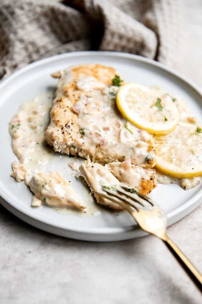 Creamy lemon garlic chicken is a quick and easy dinner idea that brings a restaurant-quality meal home. It's a flavorful and delicious 30-minute recipe. | aheadofthyme.com