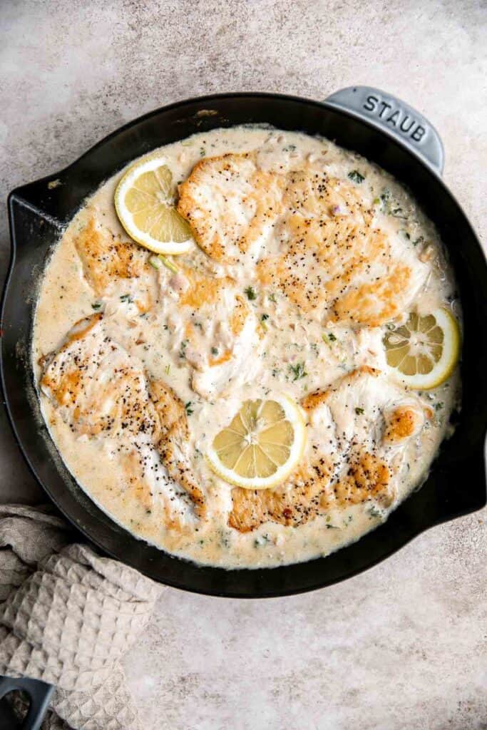 Creamy lemon garlic chicken is a quick and easy dinner idea that brings a restaurant-quality meal home. It's a flavorful and delicious 30-minute recipe. | aheadofthyme.com