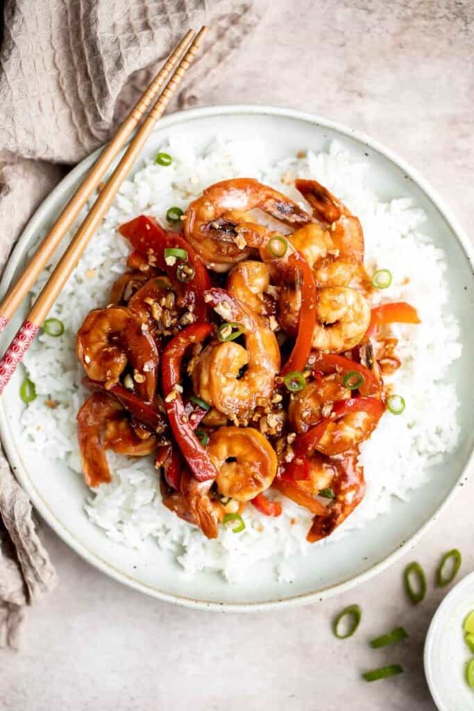 Better than takeout garlic shrimp stir fry is saucy, sticky, flavorful, and delicious. It's quick and easy to make in 15 minutes and great for meal prep. | aheadofthyme.com