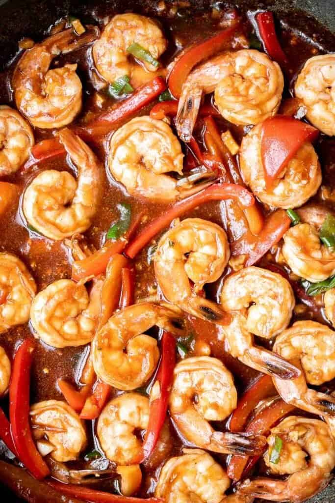 Better than takeout garlic shrimp stir fry is saucy, sticky, flavorful, and delicious. It's quick and easy to make in 15 minutes and great for meal prep. | aheadofthyme.com
