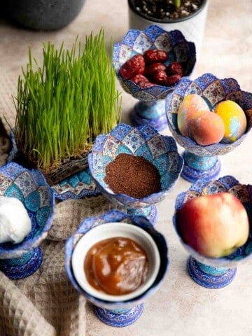 A complete guide to the traditional haft-sin table for Norouz (Persian New Year) including 7 essential items, common additional items, and Persian desserts. | aheadofthyme.com