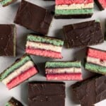 Italian rainbow cookies are delicious, colorful, fluffy, and gorgeous, made with three cake layers sandwiched in between jam and covered in chocolate. | aheadofthyme.com
