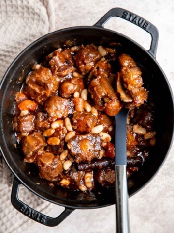 Jamaican Oxtail is juicy, delicious, and flavorful dish made with tender oxtails that fall off the bone and slow braised in a rich sauce with butter beans. | aheadofthyme.com