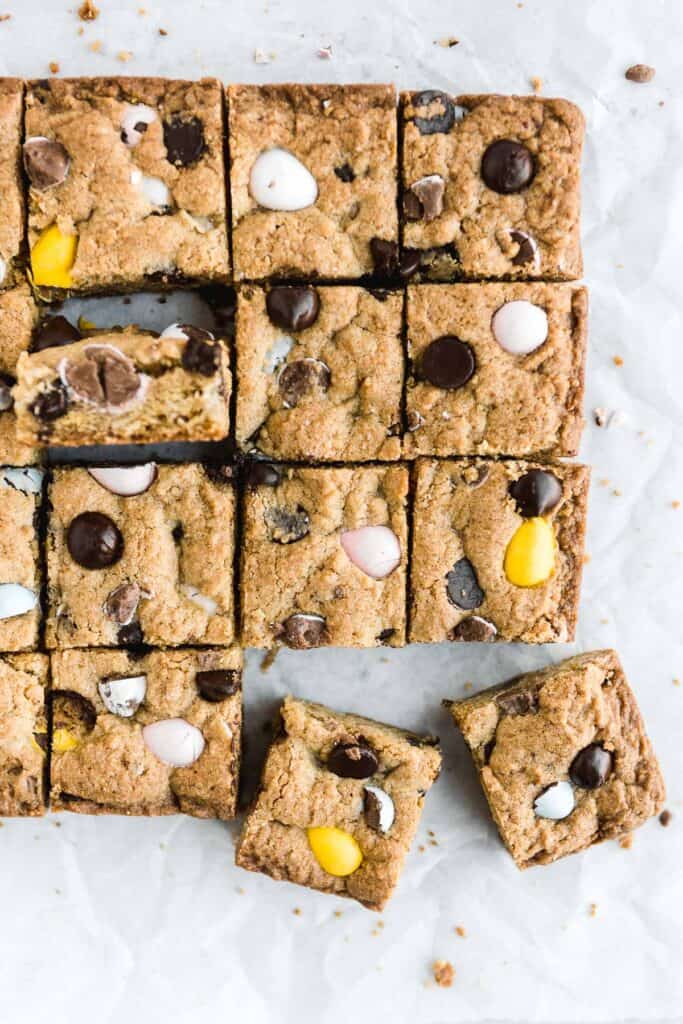 Mini egg cookie bars are a quick easy one bowl Easter dessert — soft and chewy with perfect crisp edges and a gooey center and loaded with mini eggs. | aheadofthyme.com