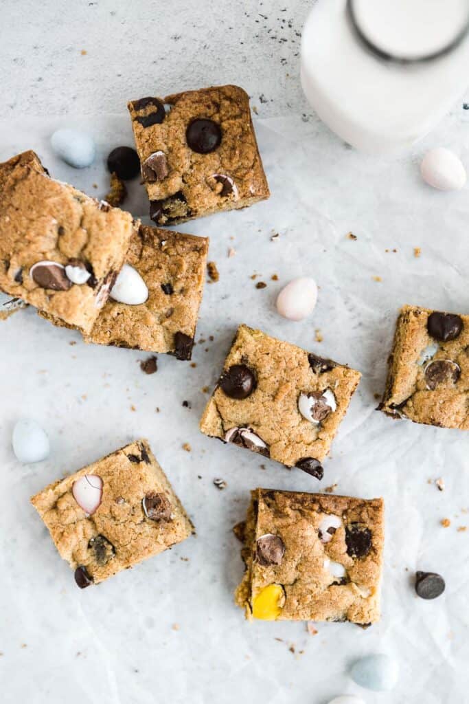 Mini egg cookie bars are a quick easy one bowl Easter dessert — soft and chewy with perfect crisp edges and a gooey center and loaded with mini eggs. | aheadofthyme.com