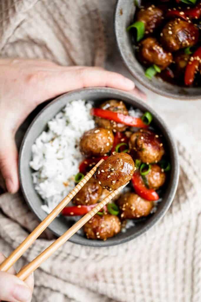 Sesame chicken meatballs are quick, easy, delicious, and loaded with Asian flavor, cooked in a homemade stir fry sauce and customizable with easy veggies! | aheadofthyme.com