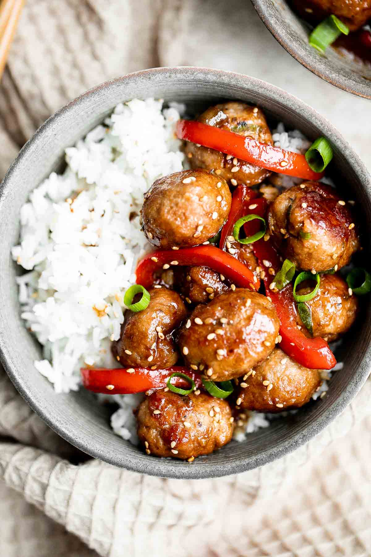 Sesame chicken meatballs are quick, easy, delicious, and loaded with Asian flavor, cooked in a homemade stir fry sauce and customizable with easy veggies! | aheadofthyme.com