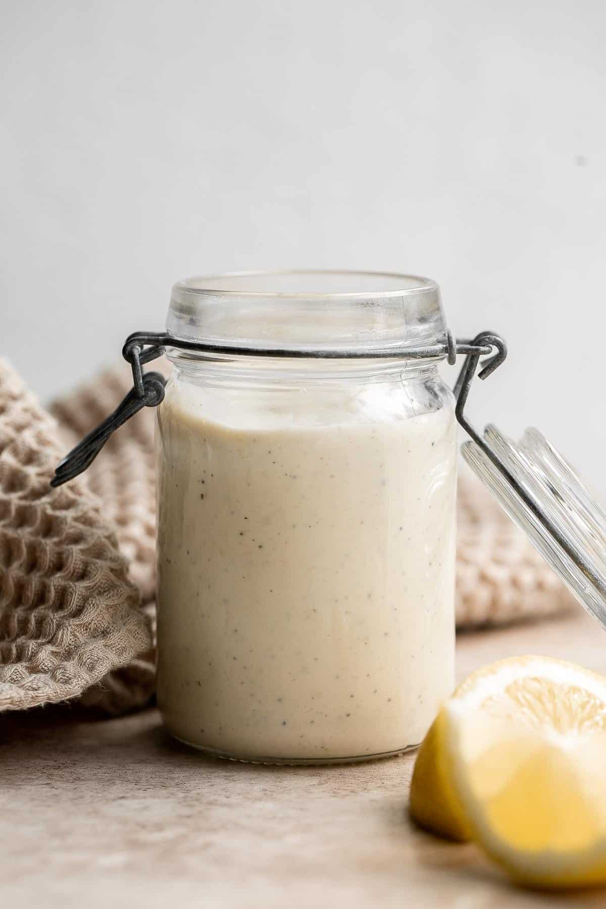 Homemade Caesar Salad Dressing is rich, creamy, and flavorful. It's a quick simple dressing made in minutes with a classic salty, earthy, and umami taste. | aheadofthyme.com