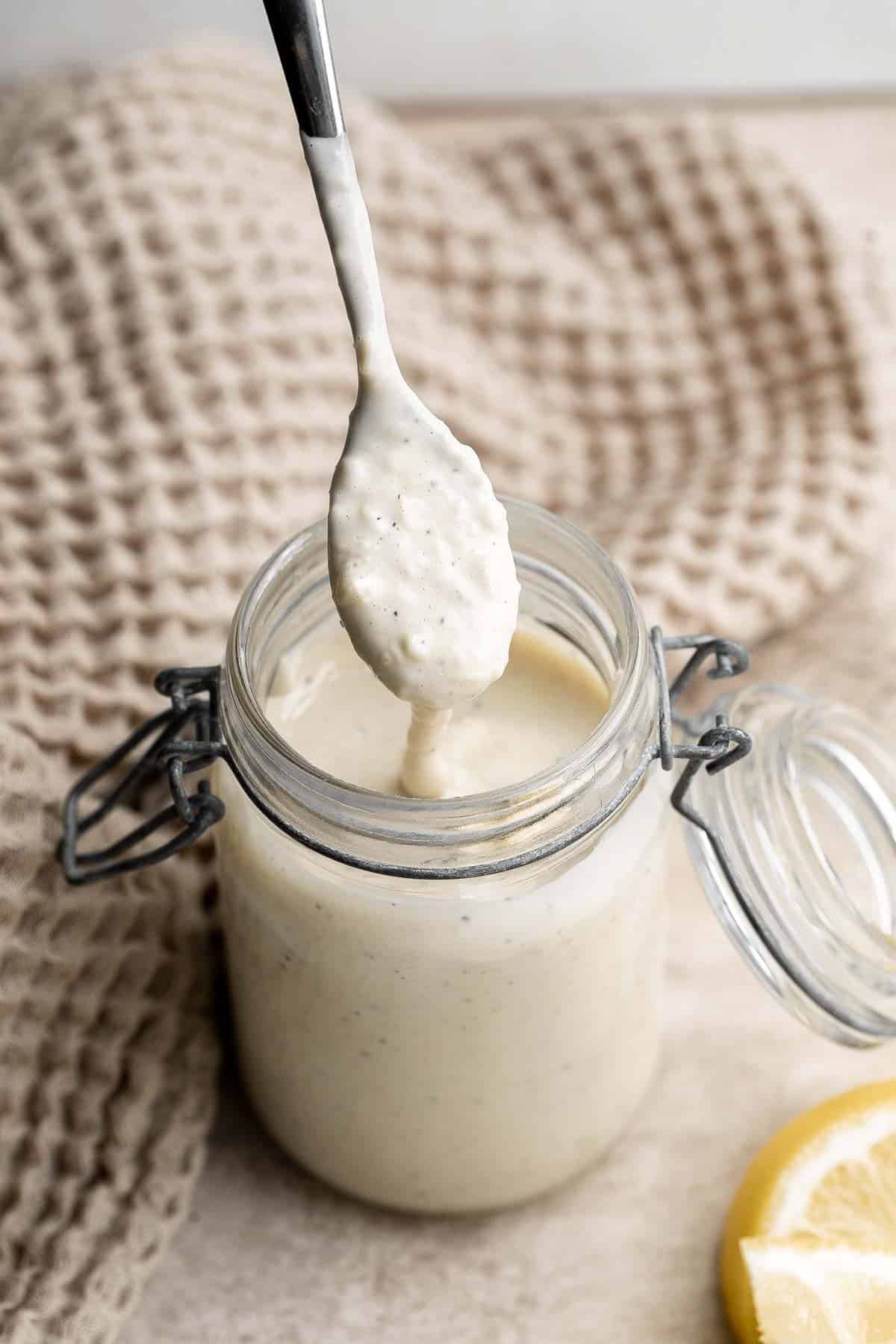 Homemade Caesar Salad Dressing is rich, creamy, and flavorful. It's a quick simple dressing made in minutes with a classic salty, earthy, and umami taste. | aheadofthyme.com