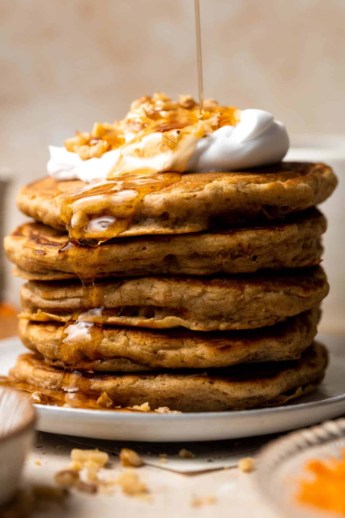 Carrot Cake Pancakes combine two of the best foods, are fluffy soft and moist, loaded with classic flavors, and are ready in 15 minutes from prep to table! | aheadofthyme.com