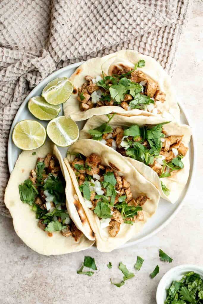 Chicken tacos are juicy and tender, loaded with flavor, delicious, and so easy to make. They are perfect for Taco Tuesday or a Cinco de Mayo Mexican fiesta. | aheadofthyme.com