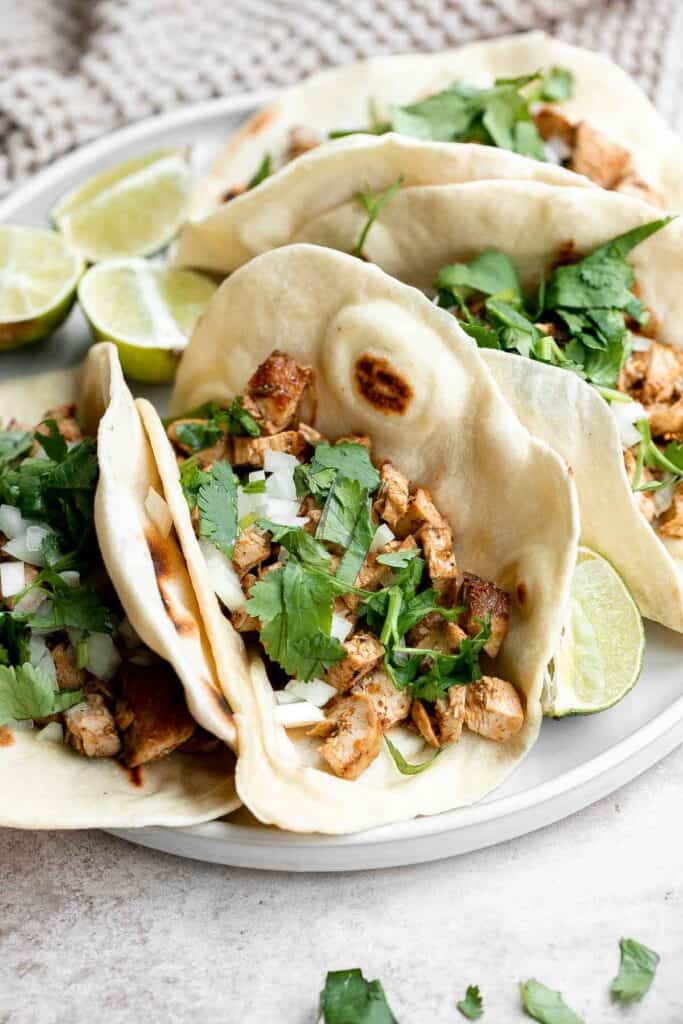 Chicken tacos are juicy and tender, loaded with flavor, delicious, and so easy to make. They are perfect for Taco Tuesday or a Cinco de Mayo Mexican fiesta. | aheadofthyme.com