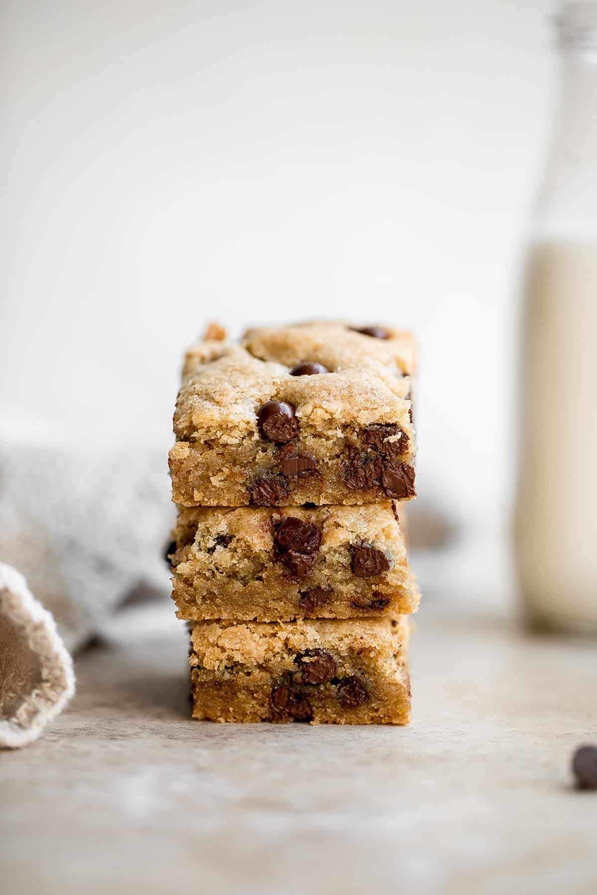 Soft and chewy chocolate chip cookie bars are a quick, easy, and lazy version of classic chocolate chip cookies that take half the prep time. | aheadofthyme.com