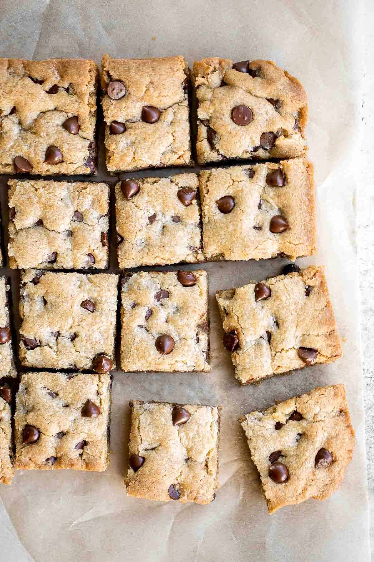 Soft and chewy chocolate chip cookie bars are a quick, easy, and lazy version of classic chocolate chip cookies that take half the prep time. | aheadofthyme.com