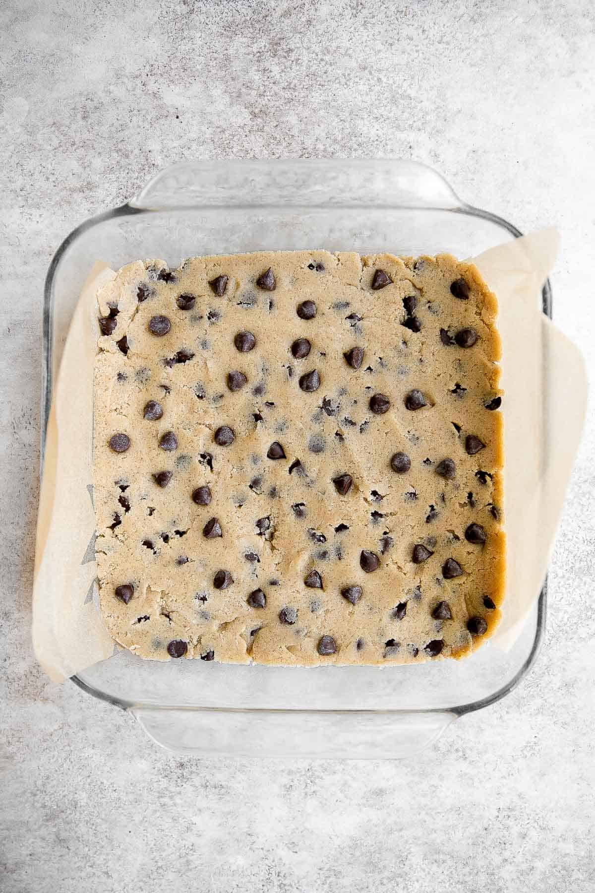 Soft and chewy chocolate chip cookie bars are a quick, easy, and lazy version of classic chocolate chip cookies that take half the prep time. | aheadofthyme.com