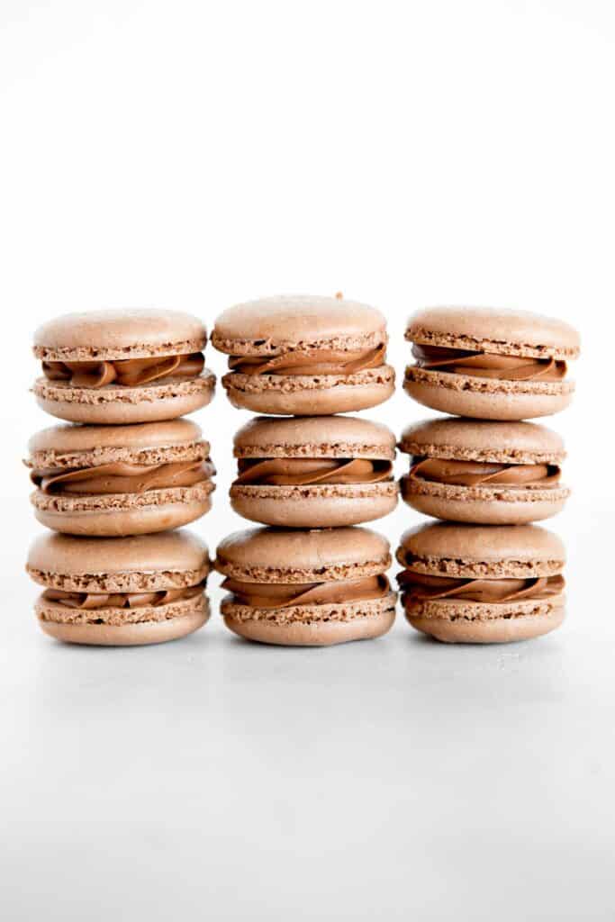 Chocolate macarons with chocolate buttercream are light and delicate, rich and sweet, and crisp and chewy. They are easier to make than you think! | aheadofthyme.com