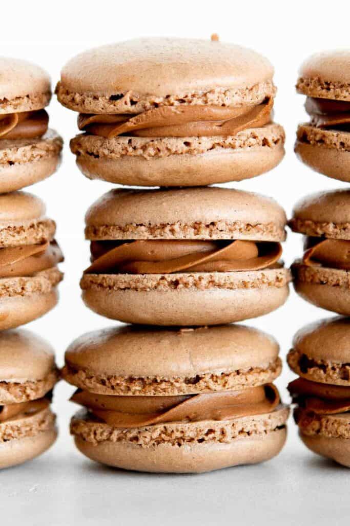 Chocolate macarons with chocolate buttercream are light and delicate, rich and sweet, and crisp and chewy. They are easier to make than you think! | aheadofthyme.com