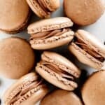 Chocolate macarons with chocolate buttercream are light and delicate, rich and sweet, and crisp and chewy. They are easier to make than you think! | aheadofthyme.com