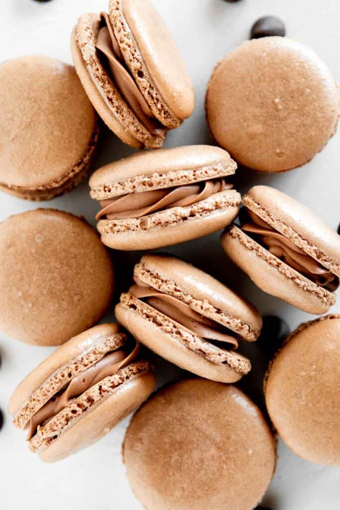 Chocolate macarons with chocolate buttercream are light and delicate, rich and sweet, and crisp and chewy. They are easier to make than you think! | aheadofthyme.com