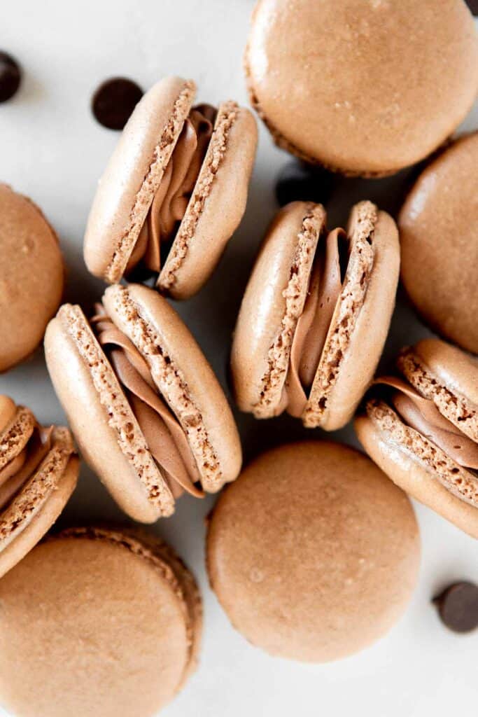 Chocolate macarons with chocolate buttercream are light and delicate, rich and sweet, and crisp and chewy. They are easier to make than you think! | aheadofthyme.com