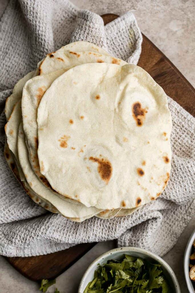 Homemade flour tortillas are delicious, soft, and so easy to make! They are easy to make with just 5 pantry staple ingredients and ready in under an hour. | aheadofthyme.com