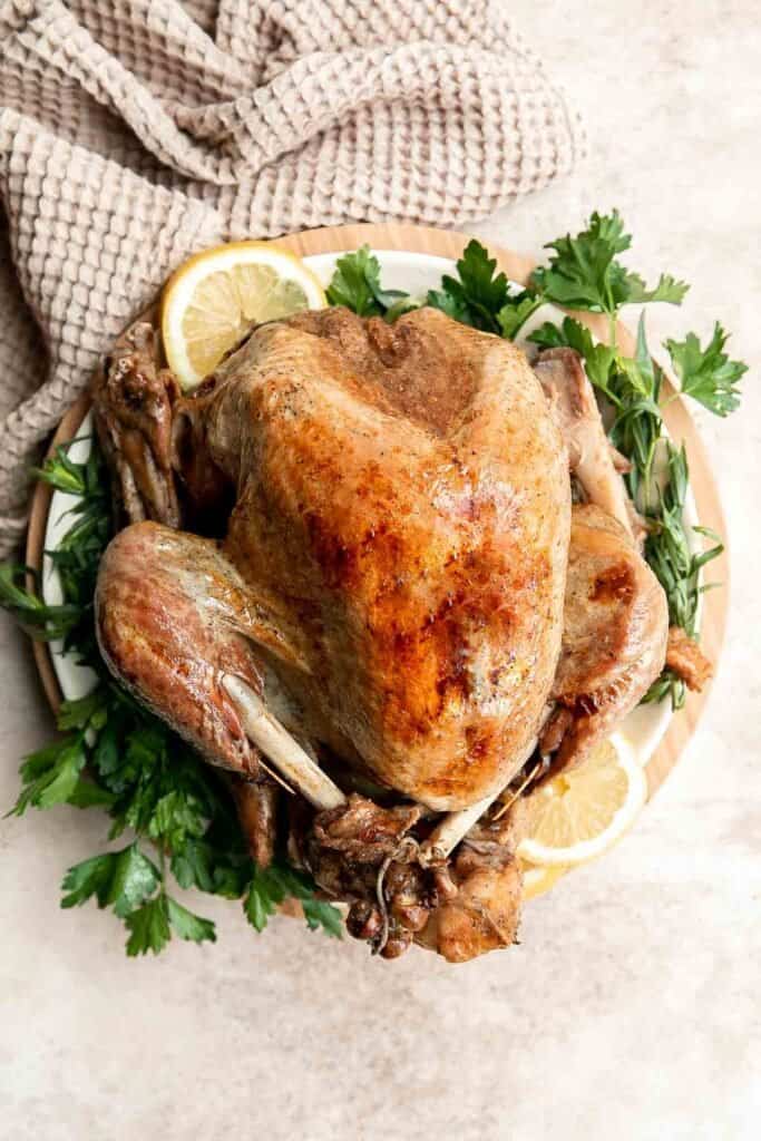 Instant pot whole turkey is a tender, juicy, and delicious holiday main. Ready in under 2 hours, it's the fastest and easiest way to cook a whole turkey! | aheadofthyme.com