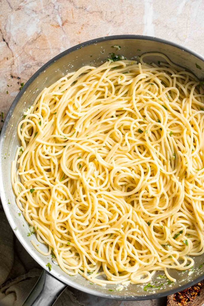Lemon butter pasta tossed until evenly coated in the buttery sauce.