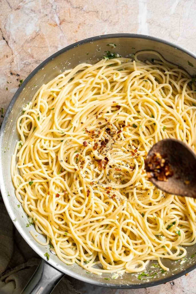 Lemon butter pasta finished with red chili flakes.