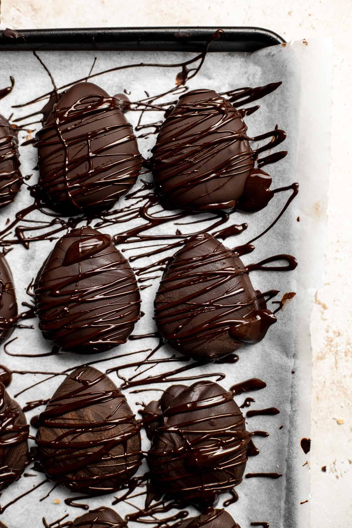 Chocolate-covered peanut butter eggs with a hard chocolate shell on the outside and a soft peanut butter interior inside are rich, sweet, and delicious. | aheadofthyme.com