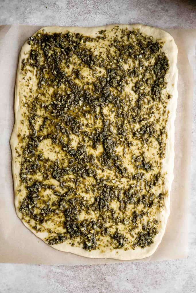 Pesto babka is a showstopping loaf of bread that is savory, delicious, and flavorful with beautiful twists and turns. Plus, it is surprisingly easy to make! | aheadofthyme.com
