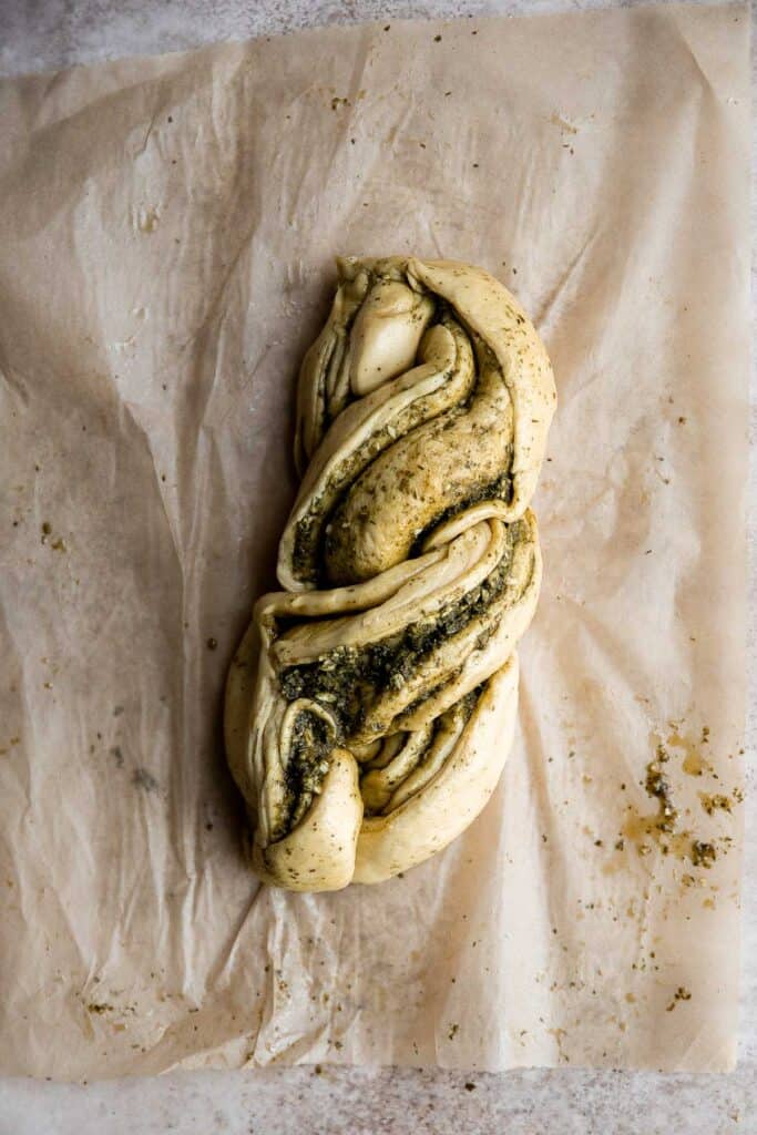 Pesto babka is a showstopping loaf of bread that is savory, delicious, and flavorful with beautiful twists and turns. Plus, it is surprisingly easy to make! | aheadofthyme.com