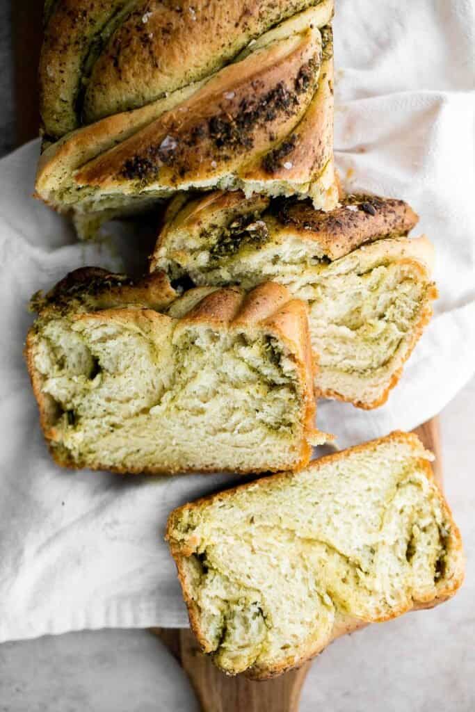 Pesto babka is a showstopping loaf of bread that is savory, delicious, and flavorful with beautiful twists and turns. Plus, it is surprisingly easy to make! | aheadofthyme.com