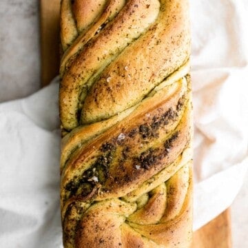 Pesto babka is a showstopping loaf of bread that is savory, delicious, and flavorful with beautiful twists and turns. Plus, it is surprisingly easy to make! | aheadofthyme.com