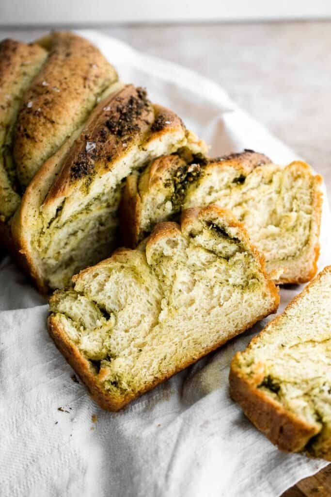 Pesto babka is a showstopping loaf of bread that is savory, delicious, and flavorful with beautiful twists and turns. Plus, it is surprisingly easy to make! | aheadofthyme.com