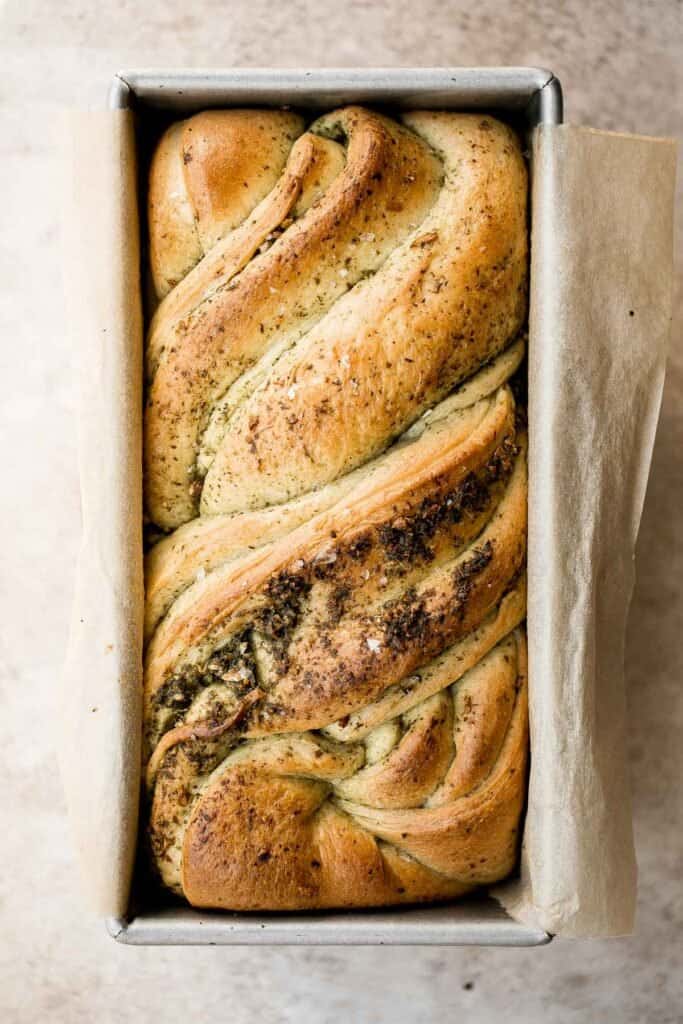 Pesto babka is a showstopping loaf of bread that is savory, delicious, and flavorful with beautiful twists and turns. Plus, it is surprisingly easy to make! | aheadofthyme.com