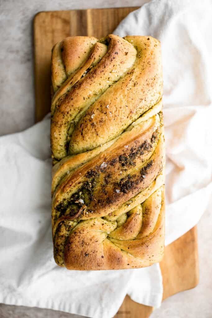 Pesto babka is a showstopping loaf of bread that is savory, delicious, and flavorful with beautiful twists and turns. Plus, it is surprisingly easy to make! | aheadofthyme.com